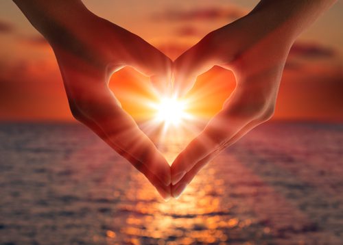 Daily Spiritual Practices Can Be Helpful in Addiction Recovery - sunset with heart shaped hands - twin lakes recovery center