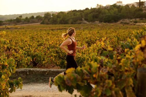 How Regular Exercise Helps Recovery - woman running in a field