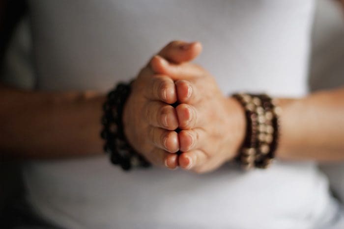 hands with bracelets pressed together