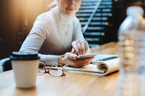 woman using cellphone at work