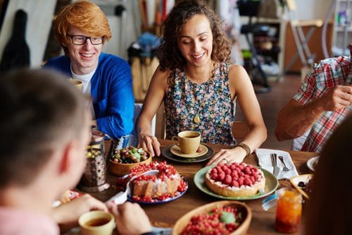 friends gathered at table for coffee and dessert - Thanksgiving