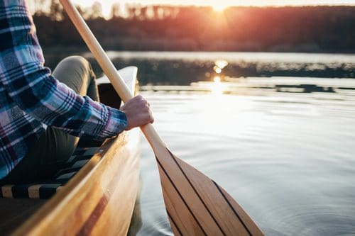 person canoeing - making exercise a priority