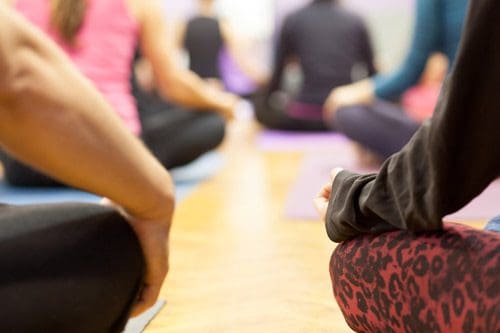 meditation class - people sitting on floor - sober friends