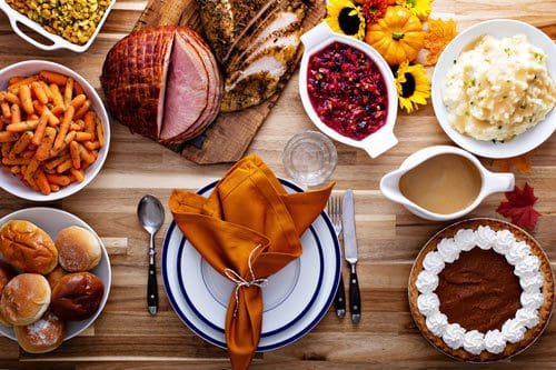 lovely table set with food for Thanksgiving meal - thanks and gratitude