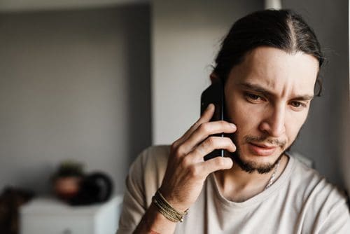 young man on cell phone - fears