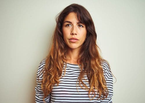 pretty young woman with long hair looking past the camera - drugs and alcohol