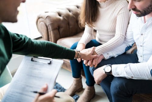 couple at therapy with counselor - family therapy