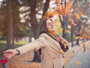 fall, autumn, leaves, woman, happy, reduce stress, holidays, Thanksgiving