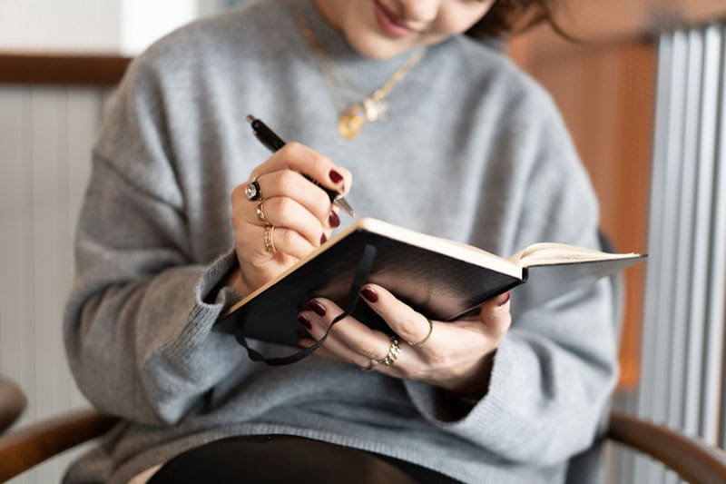 woman journaling - healthy habits in recovery